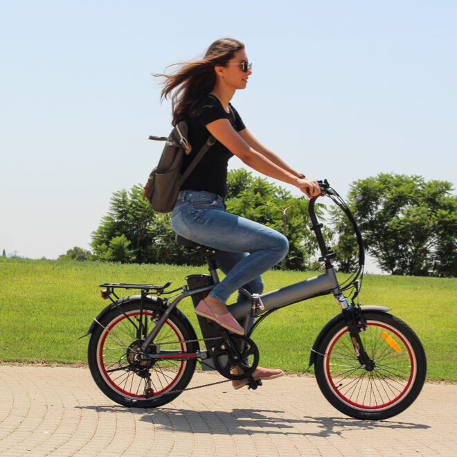 Woman riding electric bike in a park