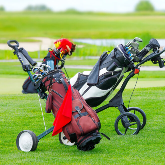 2 push golf carts on grass